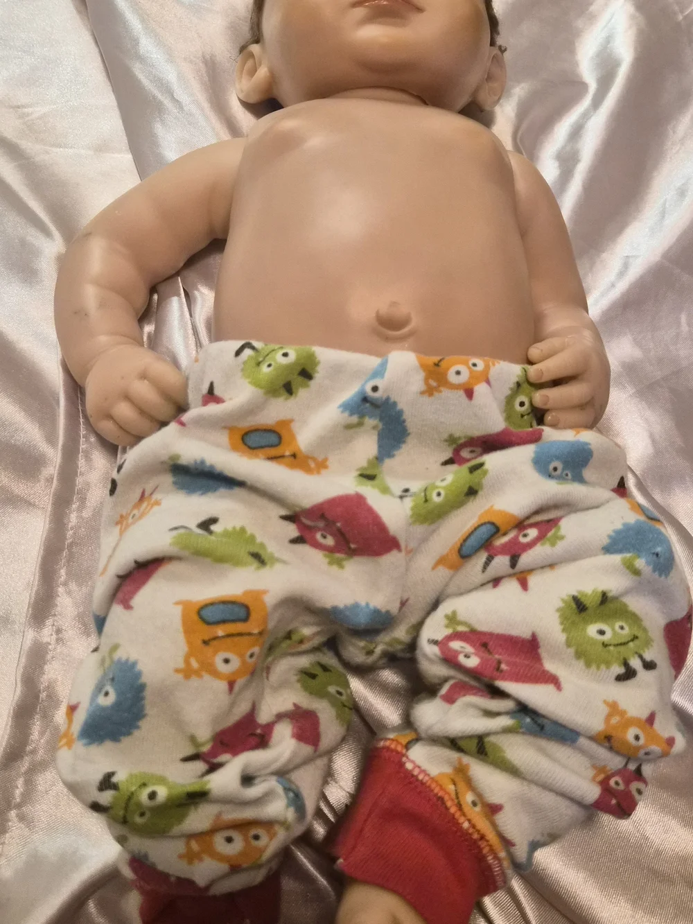 Reborn Baby Doll with Blue Eyes and Colorful Monster Pants